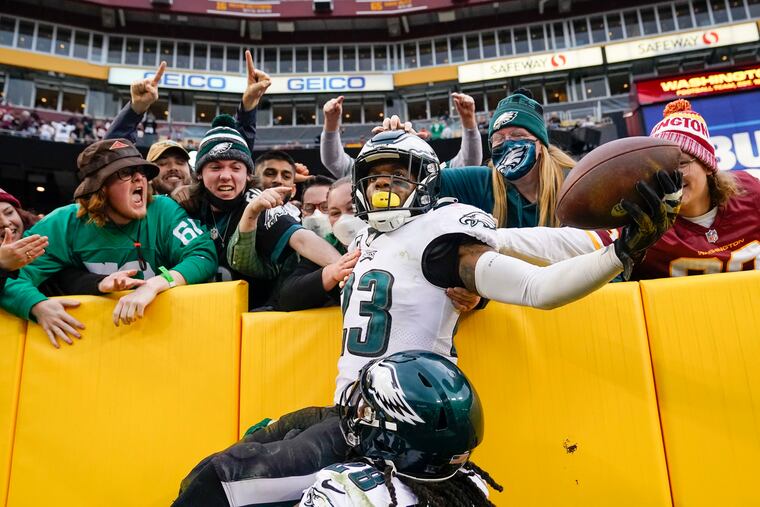 Eagles safety Rodney McLeod (23) celebrates with fans after making an interception against Washington Football Team quarterback Taylor Heinicke in the final minute of the second half.