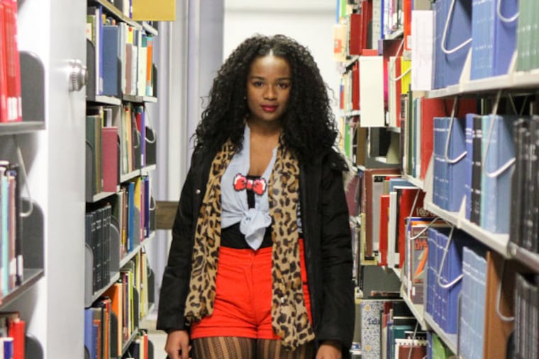 Ninqi Stratton in the library at Temple University in Philadelphia on Friday Dec. 6, 2013. (Stephanie Aaronson/Philly.com)