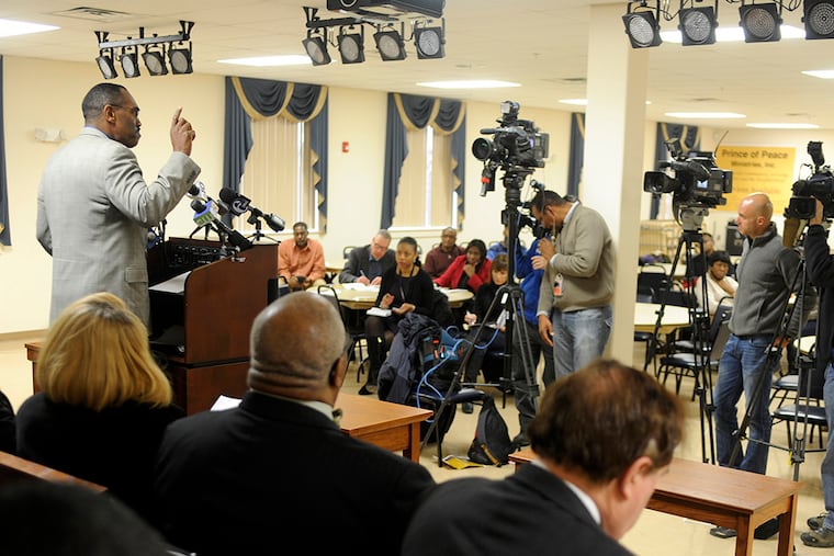 Rodney Muhammad (left) recently elected president of the Philadelphia chapter of the NAACP, speaks during a news conference December 8, 2014 to discuss alleged excessive police violence against minority suspects. ( TOM GRALISH / Staff Photographer )