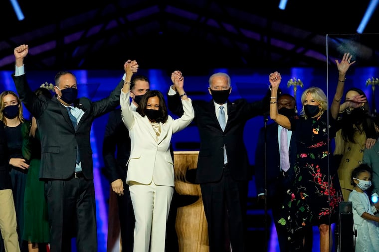 President-elect Joe Biden and Vice President-elect Kamala Harris, stand with their spouses, Dr. Jill Biden and Douglas Emhoff, after addressing the nation from the Chase Center November 07, 2020 in Wilmington, Delaware. Biden, who made unity a central message of his successful campaign, issued an urgent plea this week to Americans to put aside partisan fighting over the virus.