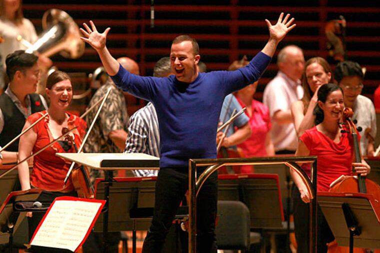Conductor Yannick Nézet-Séguin and orchestra members cheer at the end of the pop-up concert Oct. 2. (David Swanson/Staff Photographer)