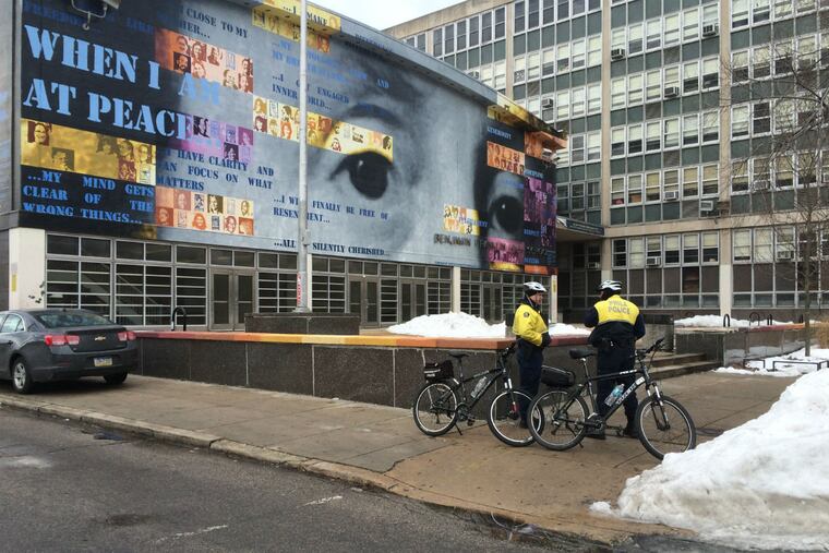 Police stand watch outside a lockdown at Ben Franklin High School on Broad Street on Jan. 29, 2016. A gun shot was fired inside the school, which prompted the lockdown.
