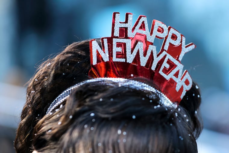 Parks and Recreation Commissioner Kathryn Ott Lovell wears a Happy New Year crown during the 2023 Mummers Parade.