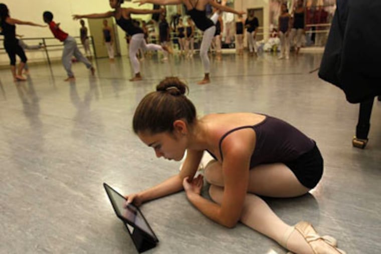 Eighth-grader Brittany DiMatteo uses her tablet to watch practice videos. (DAVID MAIALETTI / Staff Photographer)