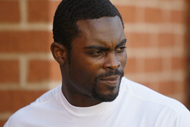 Michael Vick released a statement Thursday saying he "had nothing to do" with the shooting. (Matt Rourke/AP file photo)