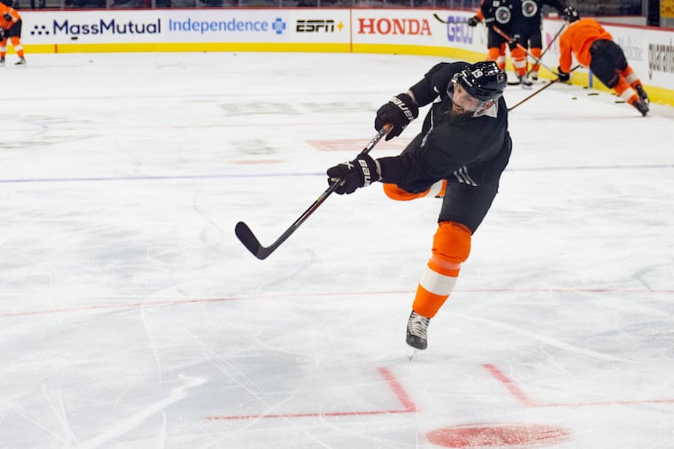Derick Brassard shoots at goalie Carter Hart during the Flyers morning skate ahead of their game against the Pittsburgh Penguins on Thursday, Jan. 6, 2022. Brassard had been out with a hip injury.