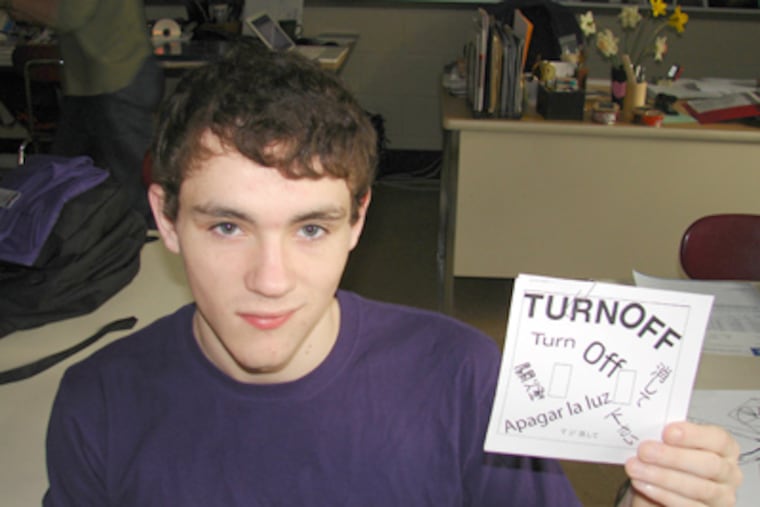 At Henderson High, Eric McGarity shows a switchplate cover. (Dan Hardy / Staff)