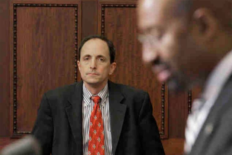 Finance Director Rob Dubow (left), shown at a news conference with Mayor Nutter.