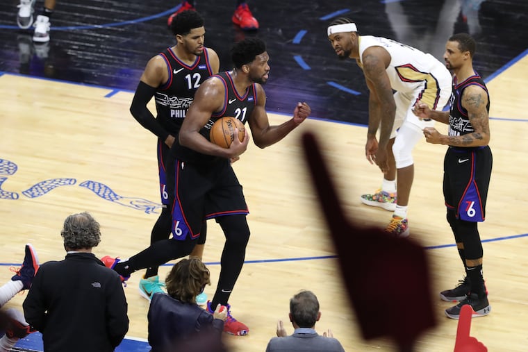 The Sixers' Joel Embiid (center) pumps his fist after it appeared the Pelicans turned the ball over late in Friday's game. Doc Rivers said Embiid winning the MVP award would be good for the entire locker room.