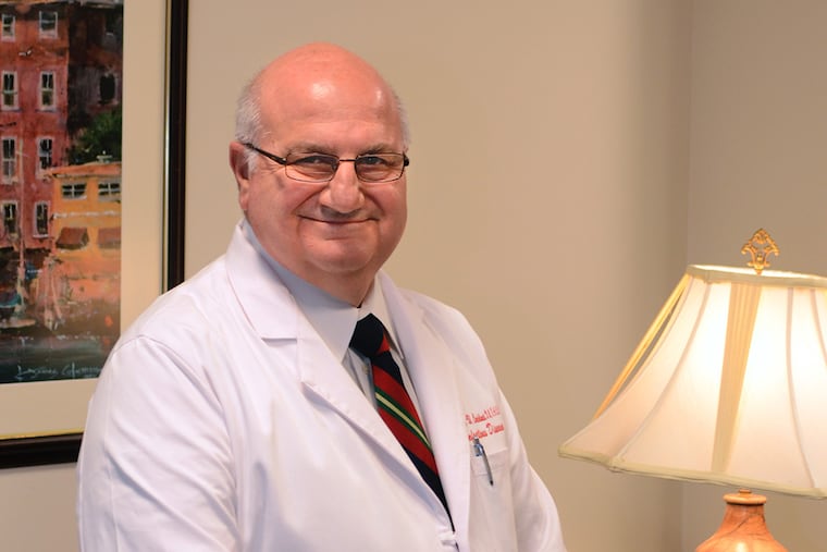 Dr. David Condoluci in his office at the Kennedy Health System campus in Stratford December 2, 2014. ( TOM GRALISH / Staff Photographer )