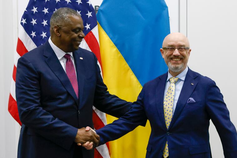 U.S. Defense Secretary Lloyd Austin, left, shakes hands with Ukraine Defense Minister Oleksii Reznikov ahead of a NATO defense ministers' meeting at NATO headquarters in Brussels on Wednesday.