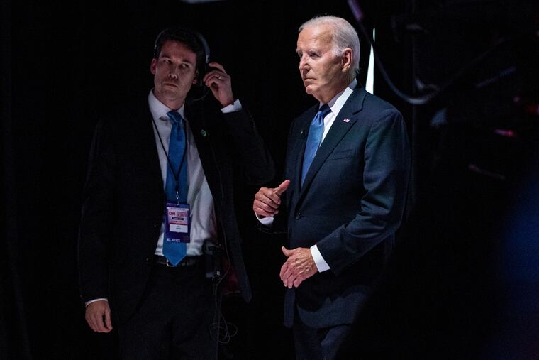 President Biden prepares to walk onstage for his debate with former president Donald Trump on June 27. Biden's halting performance that night was a key factor in his decision to ultimately withdraw from the race.