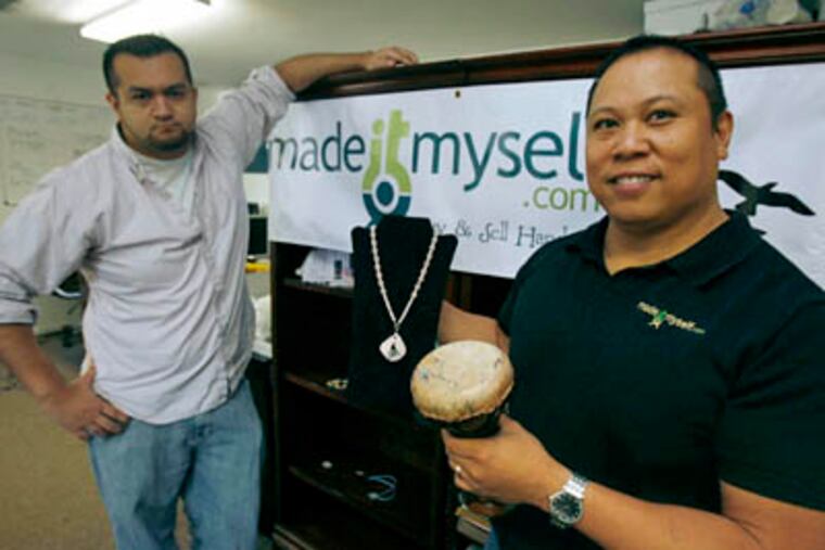 Ray Victors, president and CEO of Madeitmyself.com, right, and chief operating officer Chris Gillis, and others joined together about a year ago and created a unique business, which helps sell handmade crafts online. "It's called a super cyber mega-mall," said Victors, "and includes a national representation of artisans." (Eric Paul Zamora / Fresno Bee / MCT)