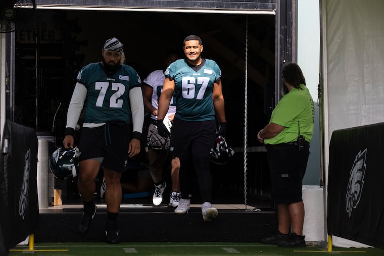 Former Eagles offensive tackle Laekin Vakalahi (right) sold his Super Bowl LIX ring on Saturday.