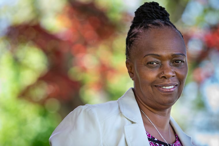 Donna Hudnell, shown here outside her Chester home, used to take medical marijuana for chronic back pain. She stopped after getting fired from her IT job at Thomas Jefferson University for failing her drug test.