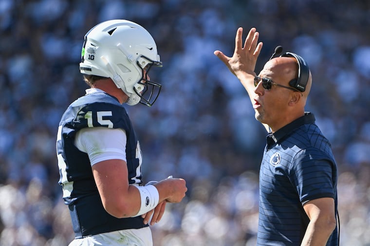 Penn State coach James Franklin talks with quarterback Drew Allar during the season-opening rout of Nevada.