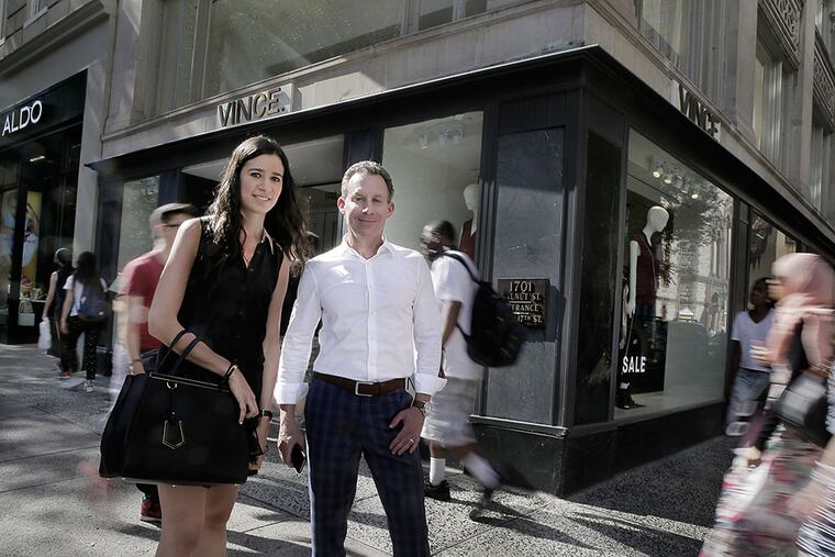Brittany Goldberg and Michael Salove of MSC Retail Inc., a real estate advisory services firm whose clients include tenants and landlords at Rittenhouse Square, in front of Vince, a high-end clothing store the firm brought to Walnut Street. ELIZABETH ROBERTSON / Staff Photographer