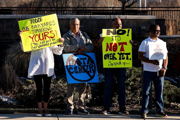 People protest the expanded data center before the East Whiteland Planning Commission meeting held at Penn State Great Valley on Monday, March 9, 2026 in Malvern.