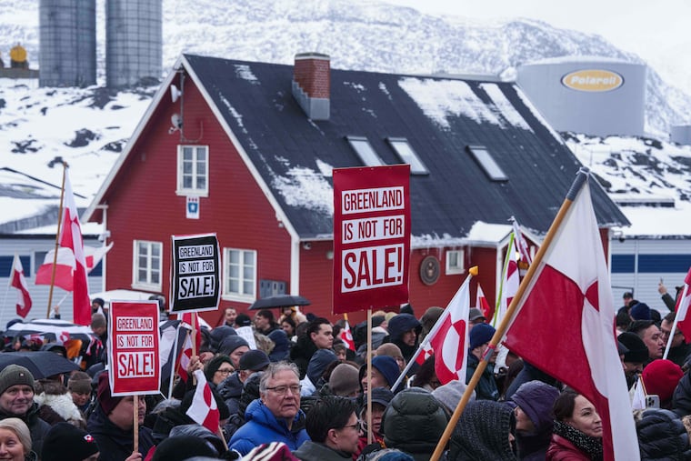 People protest against Trump's policy towards Greenland in front of US consulate in Nuuk, Greenland, Saturday, Jan. 17, 2026.