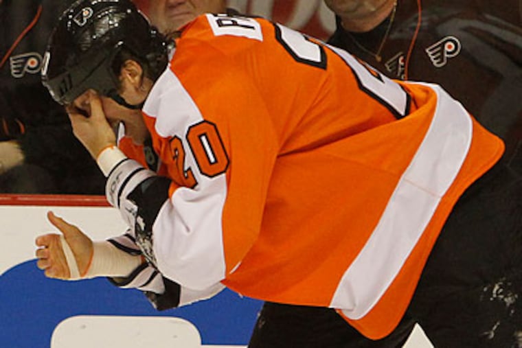 "I think Chris was really scared by this incident," Flyers general manager Paul Holmgren said. (Ron Cortes/Staff Photographer)