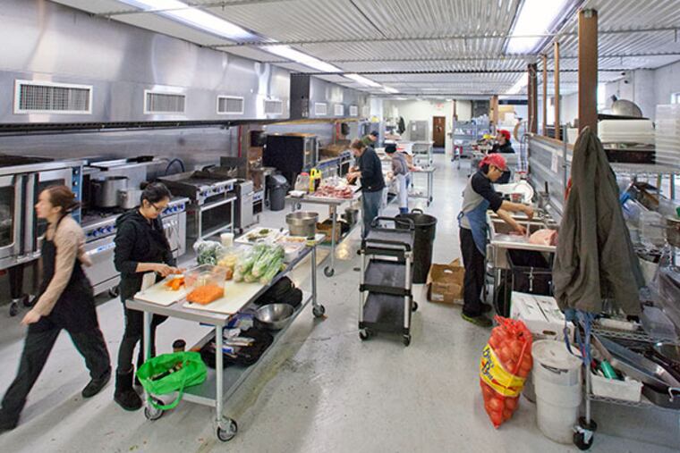 Food truck chefs preparing food in the Bridesburg Commissary, Philadelphia, January 19, 2014. ( DAVID M WARREN / Staff Photographer )