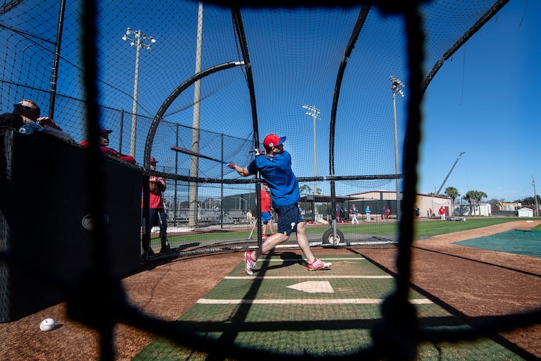 Scott Kingery takes a few pitches during workouts on Monday at the Phillies spring-training complex in Clearwater, Fla.