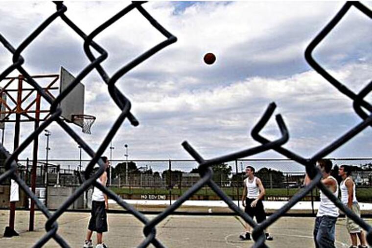 A sharp, broken fence at the American Legion Rec Center in Wissinoming was among the numerous hazards and maintenance issues found by an audit of Philadelphia's recreation centers. (Tom Gralish / Inquirer)
