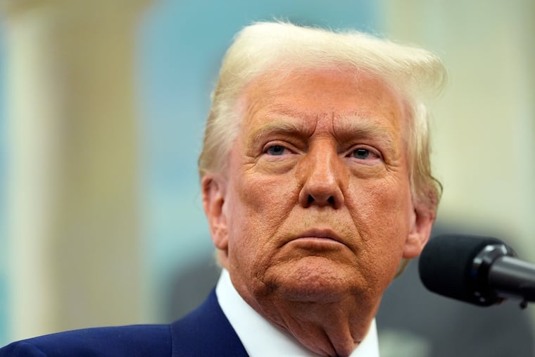 President Donald Trump speaks as Tulsi Gabbard is sworn in as the Director of National Intelligence in the Oval Office of the White House, Wednesday, Feb. 12, 2025, in Washington.