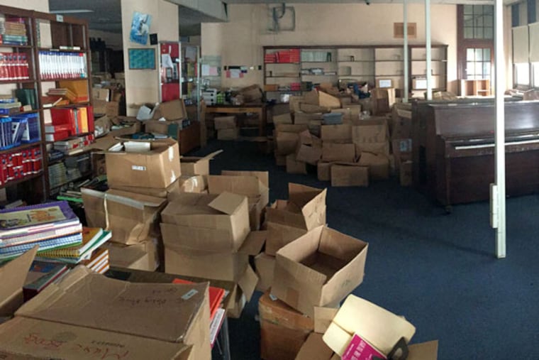 Boxes of left-behind books and music instruments crowd the library inside of the shuttered Bok High School in South Philadelphia.