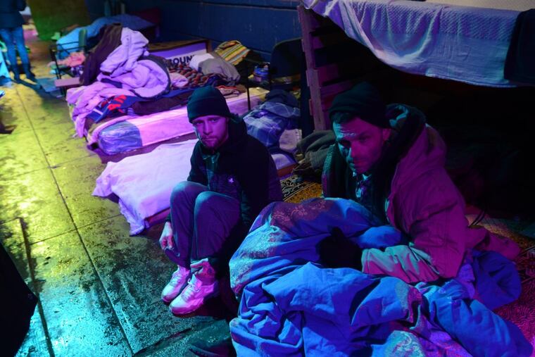 Richard Duncan, left, and a friend talk about their struggles with drug addiction and their living conditions under a bridge at Frankford and Lehigh avenue at the Kensington neighborhood in Philadelphia. Thursday, January 4, 2018.