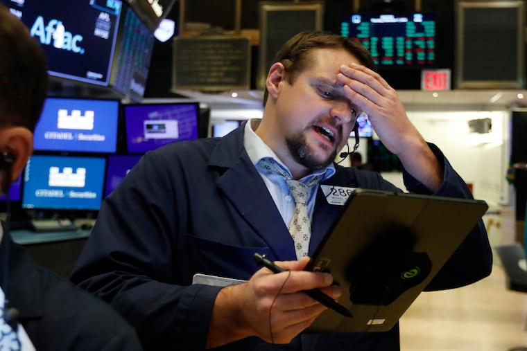 Trader Michael Milano works on the floor of the New York Stock Exchange.