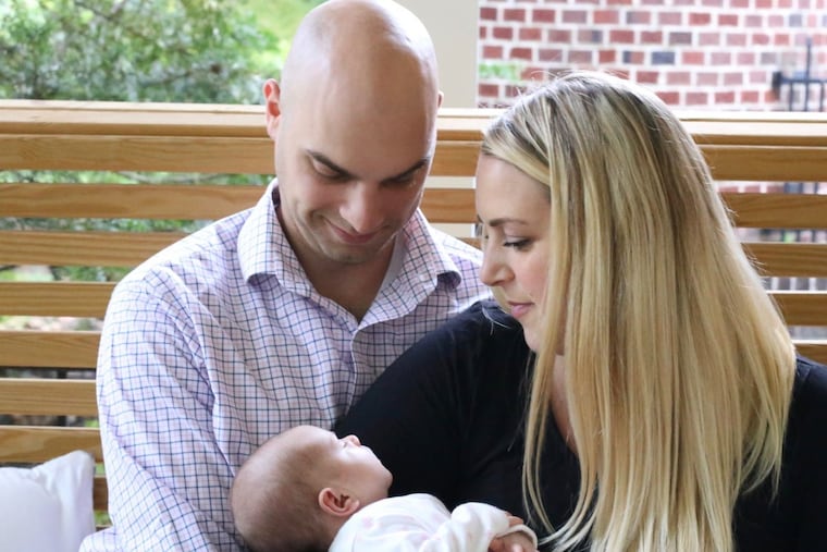 Mike and Ashley Lachman with daughter Emma.