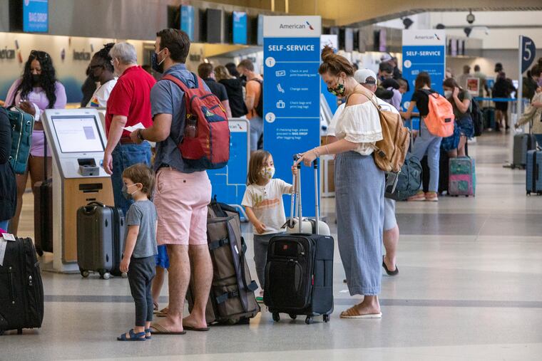Travelers at Philadelphia International Airport on July 2, 2021.