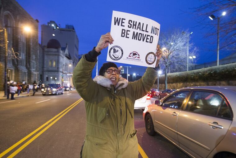 Prior to the meeting, Brenda Walker and others stood along N. Broad St. to express their feelings about the proposed stadium. The forum was canceled due to protesters.