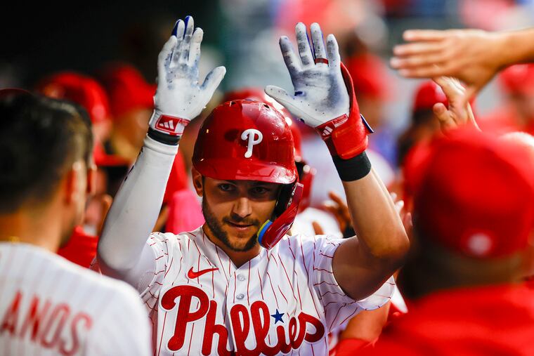 Phillies shortstop Trea Turner celebrates his three-run home run against the Kansas City Royals on Saturday with his teammates.