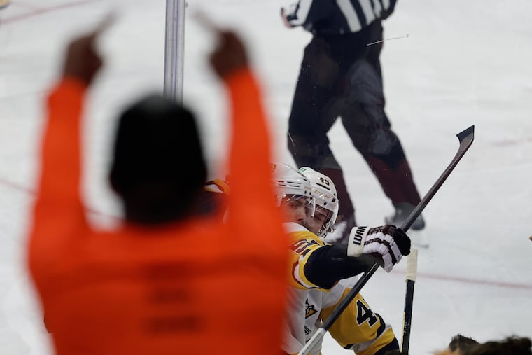 A Flyers fan gestures towards Penguins defenseman Kris Letang after his goal during the third period of Game 4 on Saturday.