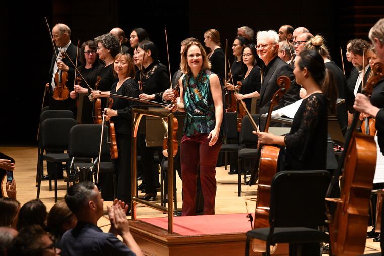 Violin soloist, Leila Josefowicz (center, in multicolor top) and composer/conductor John Adams (to the right of her in this photo) following the Sept. 26 Philadelphia Orchestra performance of Adams' Scheherazade.2. Photo by Pete Checchia.