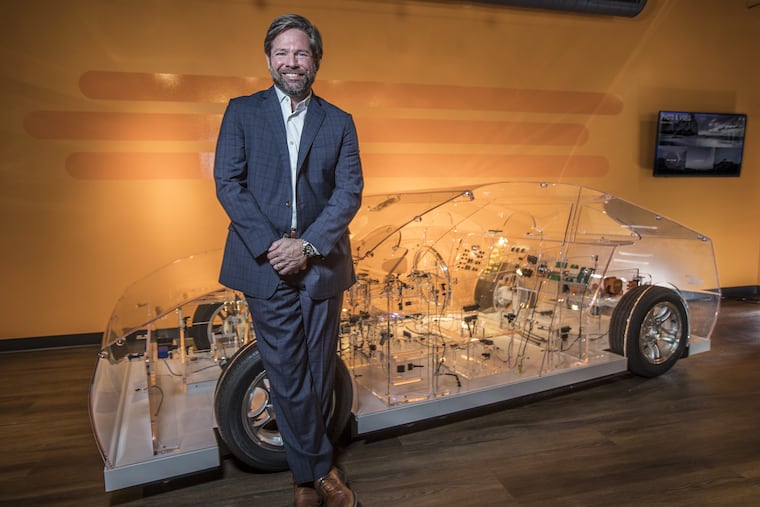 Terrence Curtin, TE Connectivity CEO, seen with a transparent car, showing all the connectors they manufacture, that go into your automobile. 05/30/2017 MICHAEL BRYANT / Staff Photographer