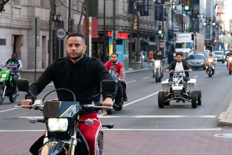 People riding motorbikes and ATVs around City Hall on southbound Broad Street in 2020.