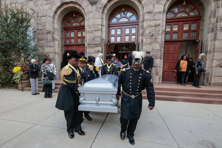 Members of the Knights of St. John, a Catholic fraternal order, carry the casket of former Daily News editor Michael Days after his funeral Mass at the Sacred Heart Church in Trenton on Oct. 25.