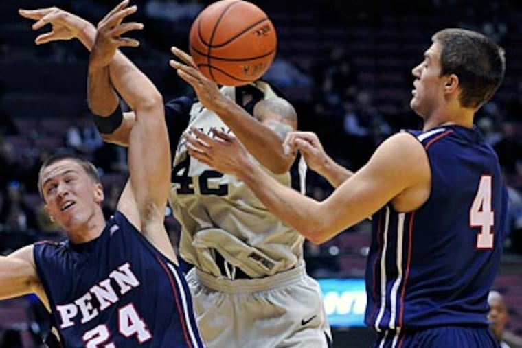 Army's Jordan Springer fights for a loose ball with Penn's Jack Eggleston, left, and Tyler Bernardini. (AP Photo/Bill Kostroun)