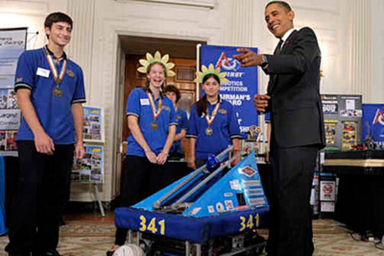 At the White House Science Fair yesterday, President Obama checks out the soccer-playing robot built by a student team from Wissahickon High School in Ambler. They won the Chairman's Award at the 2010 FIRST Robotics Championship in Atlanta.