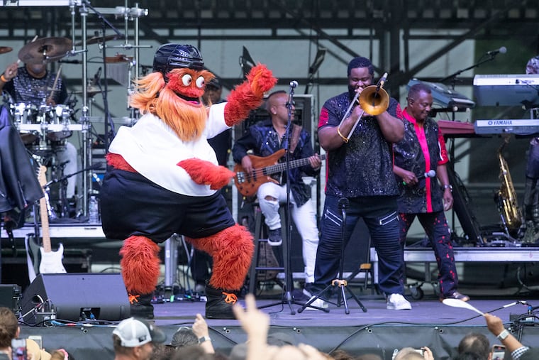 Flyers mascot, Gritty, dances with Kool and the Gang during their performance at the Hoagie Nation festival, starring Hall & Oates, Squeeze, and Kool & the Gang on Aug. 7, 2021.
