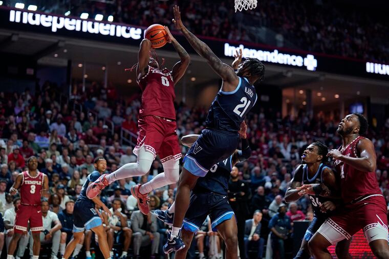 Villanova's Nnanna Njoku guards Temple's Khalif Battle during the Owls' victory on Friday night.