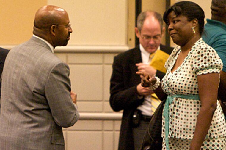 Dawn Johnson, a DHS investigator talks with Mayor Nutter after this address to hundreds of DHS employees in wake of death of Danieal Kelly. ( John Costello / Inquirer )