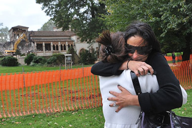 Liz Kania and Linda Kania Graupner (left) hug as the mansion La Ronda in Lower Merion is demolished. Linda grew up in La Ronda and Liz is her sister-in-law. (Sharon Gekoski-Kimmel / Staff Photographer)