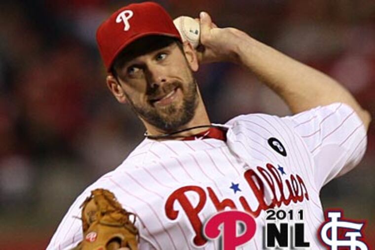 Cliff Lee throws a pitch against the Cardinals during Game 2 on Sunday night. (Clem Murray/Staff Photographer)