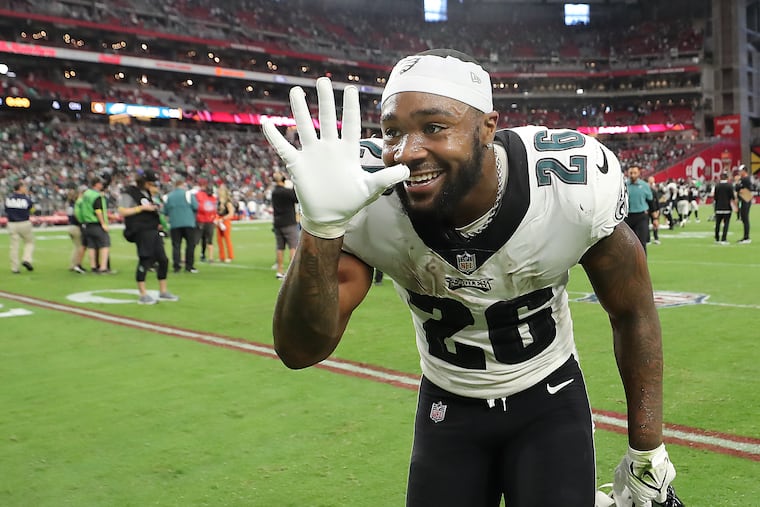 Philadelphia Eagles running back Miles Sanders holds up five fingers for the number of wins the Eagles have after defeating the Cardinals. Eagles win 20-17 over the Cardinals at State Farm Stadium in Glendale, Ariz. on Sunday, Oct. 9, 2022.