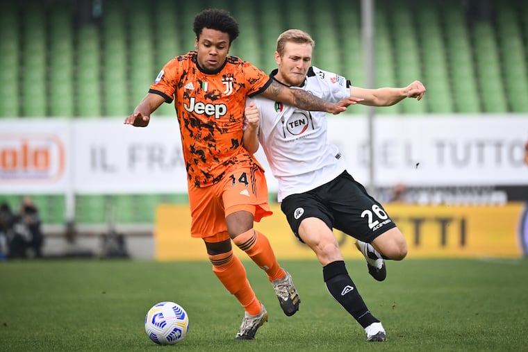 Juventus' Weston McKennie (left) competes for the ball with Spezia's Tommaso Pobega during the Serie A match on Sunday.