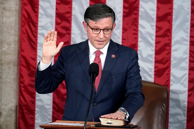 Rep. Mike Johnson, R-La., takes the oath to be the new House speaker at the Capitol in Washington on Wednesday.